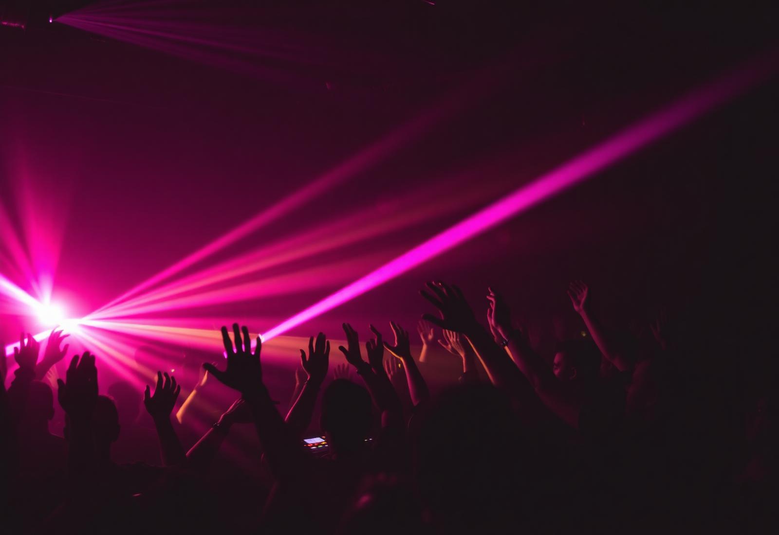 DJ performing for a packed Belfast nightclub crowd for Atmosphere Agency, Northern Ireland